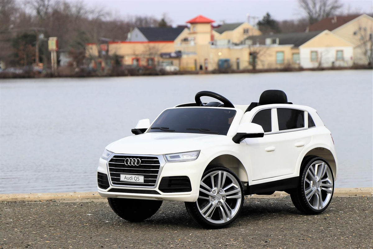 First Drive Audi Q5 White 12v Kids Cars - Dual Motor Electric Power Ride On Car with Remote, MP3, Aux Cord, Led Headlights and Rear Lights, and Premium Wheels