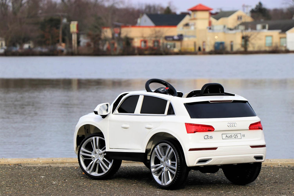 First Drive Audi Q5 White 12v Kids Cars - Dual Motor Electric Power Ride On Car with Remote, MP3, Aux Cord, Led Headlights and Rear Lights, and Premium Wheels